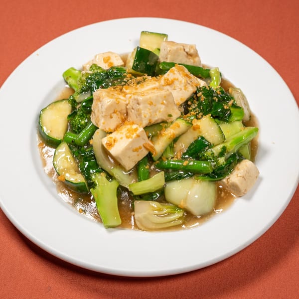 Tasty Thai Kitchen's stir-fried tofu with broccoli, zucchini, and bok choy in a savory sauce.